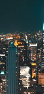 New York City skyline at night with illuminated skyscrapers.