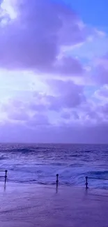 Serene purple ocean with cloudy sky wallpaper.