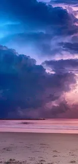 A vibrant ocean sunset with purple and blue clouds over a sandy beach.