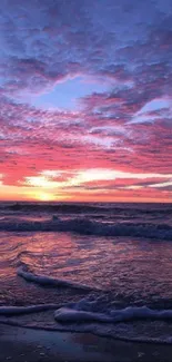 Vibrant pink and blue ocean sunset with waves.