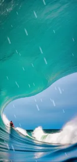 Surfer riding a vibrant blue-green ocean wave.