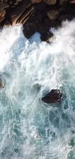 Aerial view of ocean waves crashing against rocks.