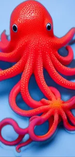 Vibrant red octopus on a blue background, perfect for phone wallpaper.