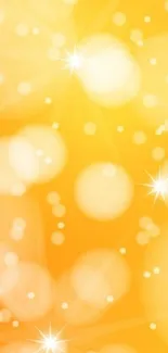 Vibrant orange bokeh wallpaper with bright lights and sparkles.