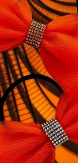 Vibrant orange bow with abstract backdrop.