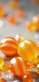 Vibrant orange striped candies on a bright background.