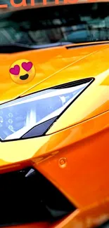 Close-up of vibrant orange supercar with sleek design and eye-catching details.