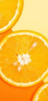 Vibrant orange citrus slices on a yellow background wallpaper.