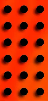 Vibrant orange wallpaper with black dots.