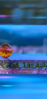 Vibrant orange sphere with blue backdrop wallpaper.