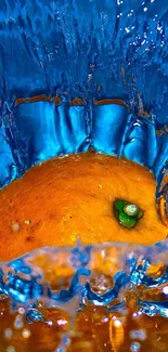 Orange fruit splashing in vivid blue water.