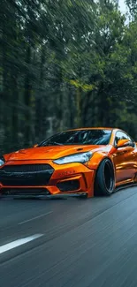 Vibrant orange sports car speeding on a scenic road.