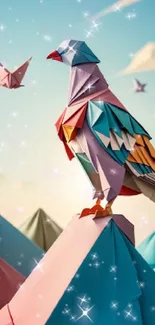 Colorful origami bird perched on a mountain with sparkles in the background.