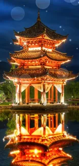 Illuminated pagoda reflecting on serene water with vibrant blue sky.