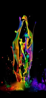 Vibrant paint splash on black background creating a colorful abstract art piece.