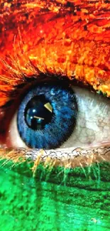 A vibrant eye painted with orange and green hues on a mobile wallpaper.