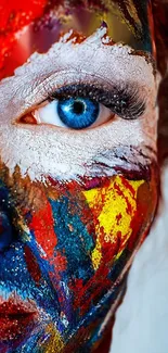 Colorful face art with blue eye and vibrant paint design.