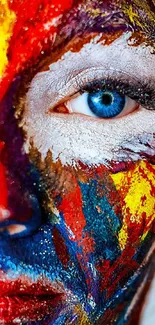 Close-up of vibrant face paint with striking blue eye.