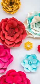 Colorful paper flowers with red, blue, and yellow accents on a mobile wallpaper.