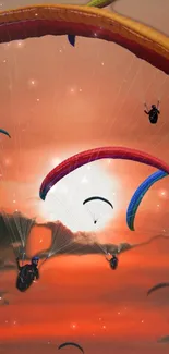 Paragliders soaring in an orange sunset sky, creating a vibrant mobile wallpaper.