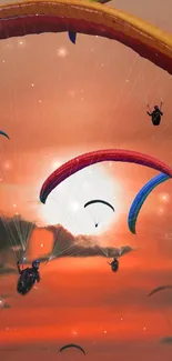 Colorful paragliders soar against a vibrant orange sunset sky.