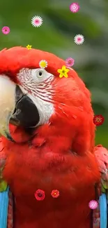 Red parrot with colorful flower accents on a lush green background.