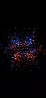 Vibrant burst of particles on black background wallpaper.