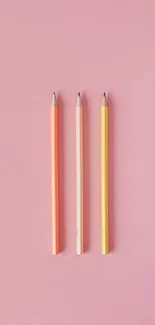 Vibrant pastel pencils on a soft pink background mobile wallpaper.