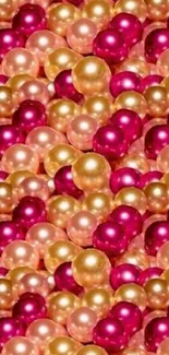 Vibrant mobile wallpaper with pink, gold, and peach pearl spheres.