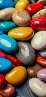 Vibrant and colorful pebble art on a mobile wallpaper.