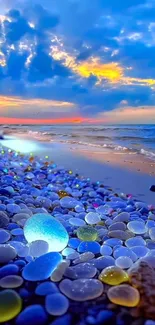 Vibrant sunset over a pebble beach with colorful stones and a vivid sky.