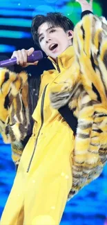 Performer in yellow suit with dynamic stage lighting.