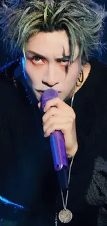 Performer with vibrant hair and makeup holding a purple microphone.