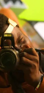 Photographer capturing with camera, vibrant background.