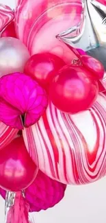 Vibrant pink balloons with metallic accents.