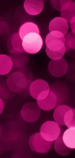 Vibrant pink bokeh mobile wallpaper with blurred circles.