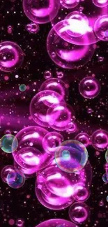 Vibrant pink bubbles on a dark background creating a lively phone wallpaper aesthetic.