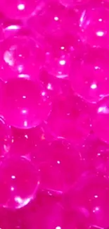 Vibrant pink bubble texture on mobile wallpaper.