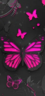 Neon pink butterflies on dark background wallpaper.