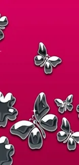 Vibrant pink wallpaper with silver butterflies.