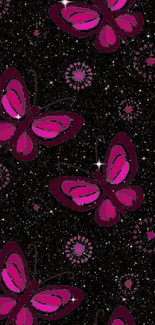 Vibrant pink butterflies on starry black background wallpaper.