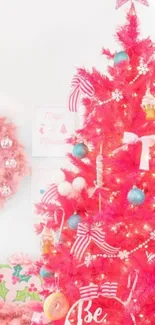 Vibrant pink Christmas tree with festive ornaments and decor.