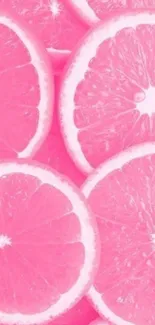 Vibrant pink citrus slices wallpaper with grapefruit design.