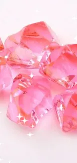 Five vibrant pink crystals on a white background.