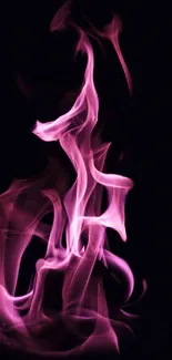 Pink flames swirling on a dark backdrop, creating an artistic visual.