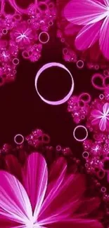 Vibrant pink floral wallpaper with abstract flowers and circles.