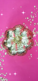 Vibrant pink wallpaper with sparkling sequin flower.