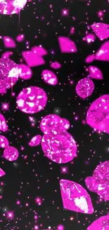 Vibrant pink gemstones on black background.