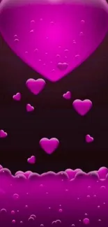 Vibrant pink heart wallpaper with bubbles and floating hearts.