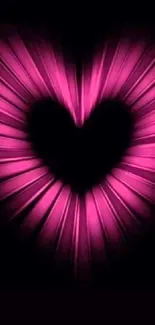 Vibrant pink heart glowing in the dark.